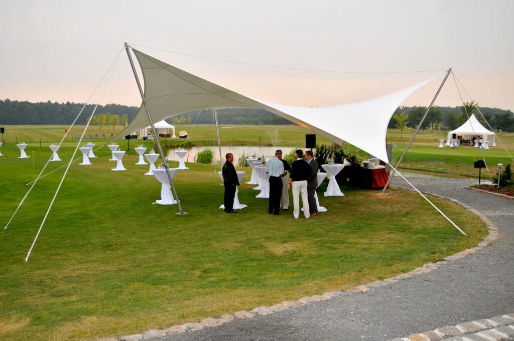 The tent here creates an elegant setting for the event on the golf course 